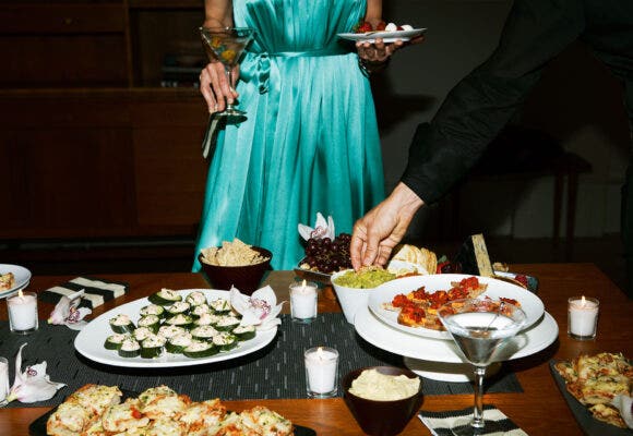 People eating food with cocktails