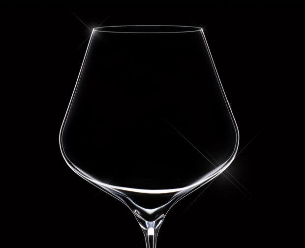 Close-up on a silhouette of a wine glass